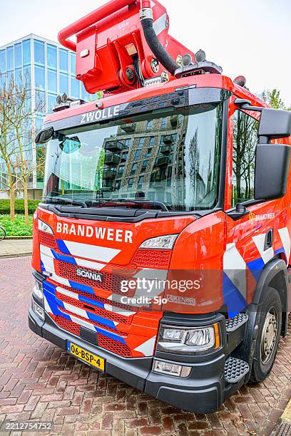 fire engine at the scene of a fire - ambulance nederland stockfoto's en -beelden
