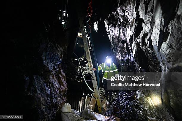 Mark Austin, Chief Operating Officer at Alba Mineral Resources, moves through Clogau St David's Gold Mine on May 2, 2025 in Barmouth, Wales. Gold has...