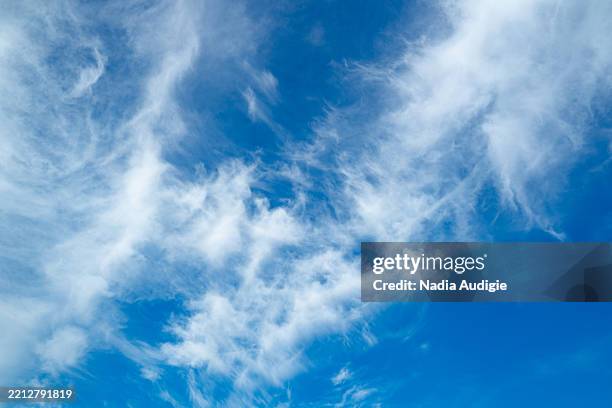 blue sky with white clouds background - cirrostratus stock pictures, royalty-free photos & images