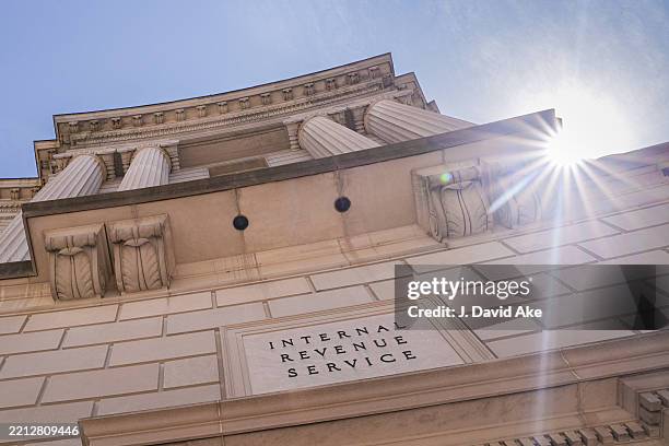 The sun flares over the top of the Internal Revenue Service headquarters building on April 30 in Washington, DC.