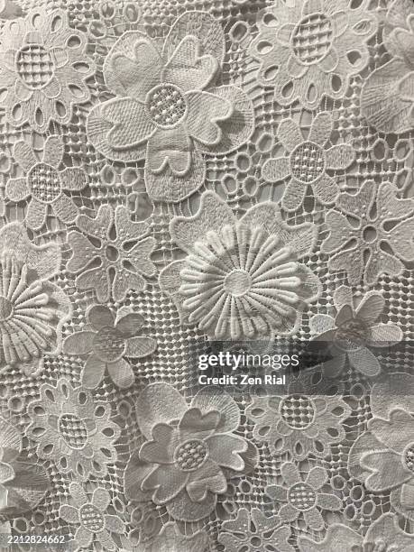 white eyelet fabric with 3d flower appliques - appliqué stock pictures, royalty-free photos & images