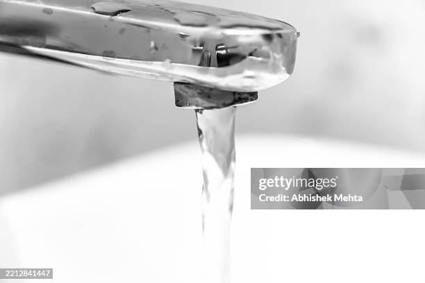 water flowing - household fixture stock pictures, royalty-free photos & images