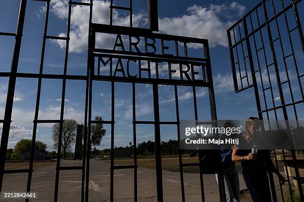 The infamous "Arbeit Macht Frei" inscription stands at the entrance gate of the former Sachsenhausen concentration camp near Berlin on April 30, 2025...