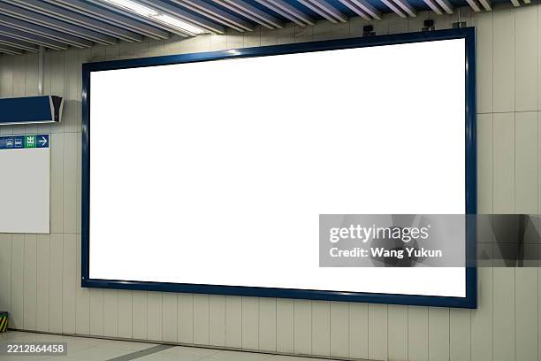 large blank billboard in subway station - billboard posting stock pictures, royalty-free photos & images