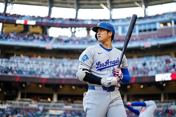 Shohei Ohtani of the Los Angeles Dodgers looks on prior to the game between the Los Angeles Dodgers and the Atlanta Braves at Truist Park on Sunday,...
