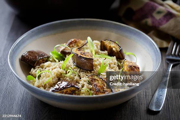healthy brown rice and grilled aubergine bowl - brown rice stock pictures, royalty-free photos & images