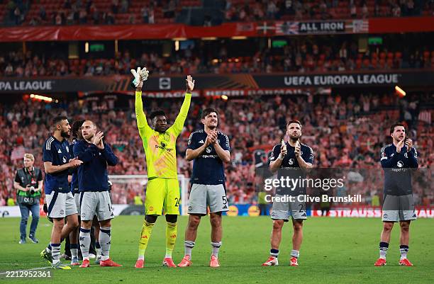 Andre Onana, Harry Maguire, Luke Shaw and Mason Mount of Manchester United acknowledge the fans after the teams 3-0 victory in the UEFA Europa League...