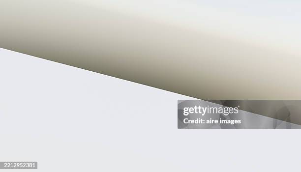 abstract background with diagonal dividing white and beige areas - arte minimalista fotografías e imágenes de stock