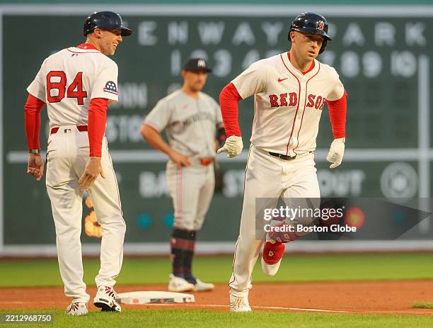 Boston Red Sox third baseman Alex Bregman rounds third base after hitting a home run at Fenway Park.