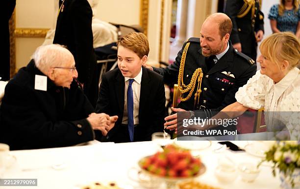 Prince William, Prince of Wales and Prince George join Second World War veterans at a tea party in Buckingham Palace following the military...