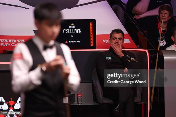 Ronnie O'Sullivan of England reacts against Zhao Xintong of China during the semi final match on day fourteen of the Halo World Snooker Championship...