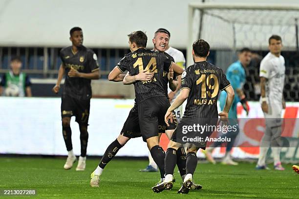 Danylo Sikan of Trabzonspor celebrates with teammates after scoring a goal during the Turkish Super Lig week 34 match between Kasimpasa and...