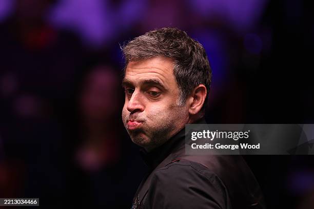 Ronnie O'Sullivan of England reacts against Zhao Xintong of China during the semi final match on day fourteen of the Halo World Snooker Championship...