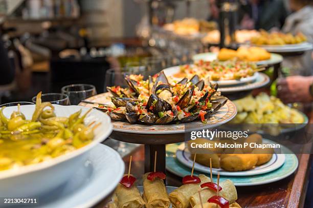 typical pintxos and tapas selection - san sebastian, donostia, basque region, spain - saint-sébastien-espagne photos et images de collection