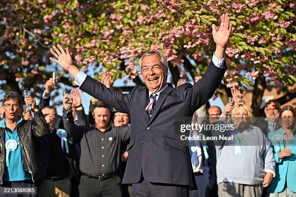 Leader of Reform UK Nigel Farage cheers while addressing supporters and the media at Staffordshire County Showground after Reform won control of...