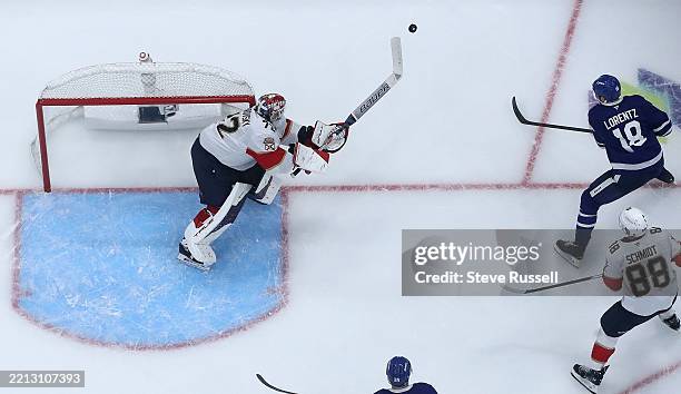 Florida Panthers goaltender Sergei Bobrovsky bats the puck away from Toronto Maple Leafs center Steven Lorentz as the Toronto Maple Leafs beat the...