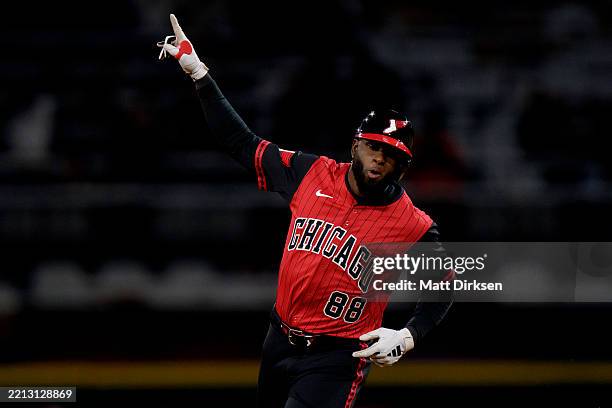 Luis Robert Jr of the Chicago White Sox celebrates a solo home run in the bottom of the fifth inning in a game against the Houston Astros at Rate...