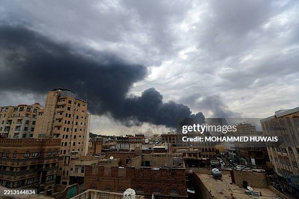 Smoke billows on the horizon following an Israeli air strike on Yemen's Huthi-held capital Sanaa on May 6, 2025. Israeli air raids struck Yemen's...