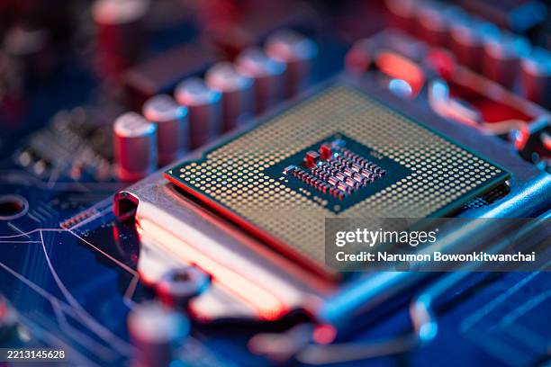 the close up image of the cpu and motherboard - computerchip stock-fotos und bilder