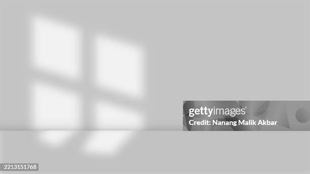 empty studio room with shadow and table for showing products - product spotlight stock illustrations