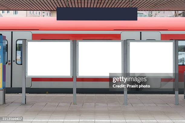 three blank billboards at train station platform - train billboard stock pictures, royalty-free photos & images