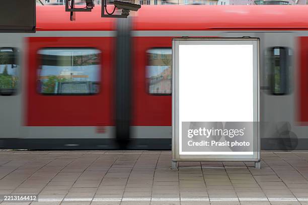 blank billboard at train station with passing train - train billboard stock pictures, royalty-free photos & images