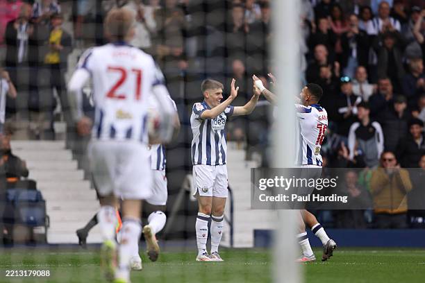Tom Fellows of West Bromwich Albion celebrates scoring his team's first goal with teammate Karlan Grant during the Sky Bet Championship match between...
