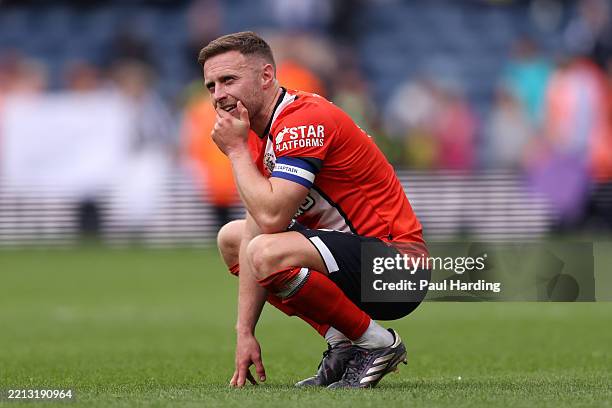 Jordan Clark of Luton Town looks deject after defeat confirmed the teams relegation to Sky Bet League One in the Sky Bet Championship match between...