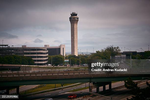 An airport control tower is seen at Newark Liberty International Airport, on May 6, 2025 in Newark, New Jersey. Passengers traveling to, from, or...