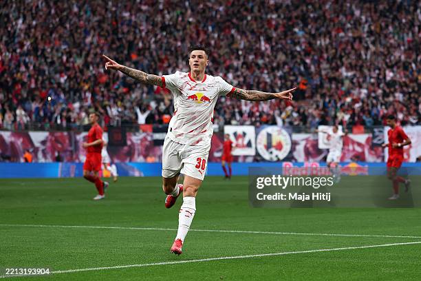 Benjamin Sesko of RB Leipzig celebrates scoring his team's first goal during the Bundesliga match between RB Leipzig and FC Bayern München at Red...