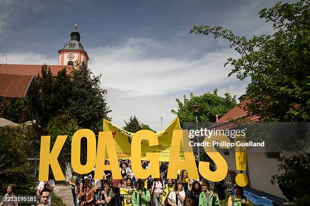 People protest against a new natural gas drilling site in Bavaria on May 3, 2025 near Reichling, Germany. Activists from a variety of organizations,...