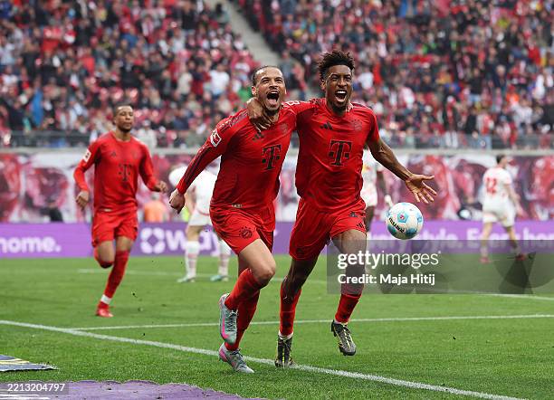 Leroy Sane of Bayern Munich celebrates scoring his team's third goal with teammate Kingsley Coman during the Bundesliga match between RB Leipzig and...
