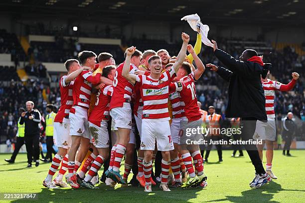 Harry Clifton of Doncaster Rovers celebrates after the teams 2-1 victory, which confirmed that the team has won the Sky Bet League Two and promotion...
