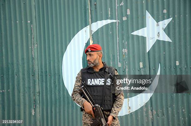Soldiers take security measures near the damaged mosque situated at health and education complex which was hit by Indian strike in Muridke, near...