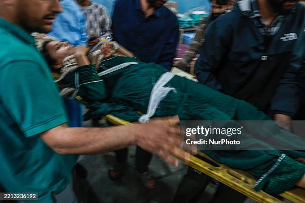 Civilians tend to their injuries following Pakistani shelling in Baramulla district. The Indian military says early Wednesday it launches strikes...