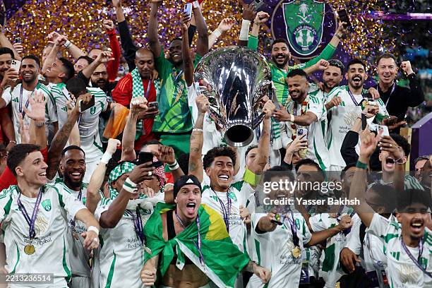 Roberto Firmino of Al-Ahli Saudi lifts The AFC Champions League Elite trophy after his teams 2-0 victory following the AFC Champions League Elite...