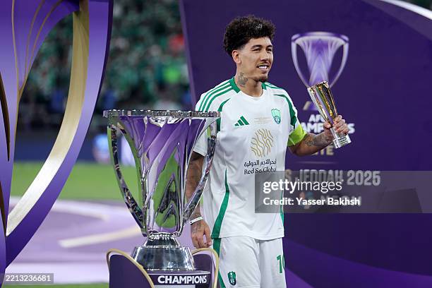 Roberto Firmino of Al-Ahli Saudi pose for a photo with the player of the match trophy during the AFC Champions League Elite Final between Al Ahli and...