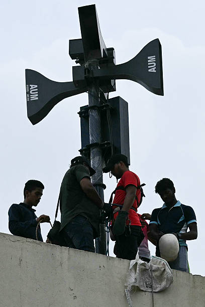 Civil defense volunteers check an air raid sirens as they take part in an emergency simulation drill as part of the nationwide civil defence mock...