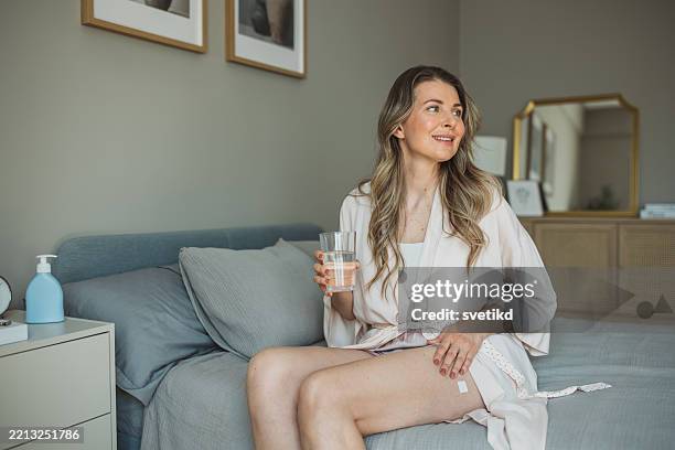 hormone replacement therapy - transdermal patch stock pictures, royalty-free photos & images