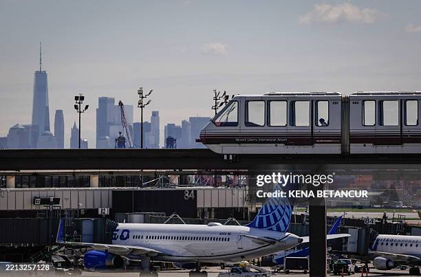 United plane is parked at the gate at Newark Liberty International Airport in Newark, New Jersey on May 7, 2025. Regulators have been slowing...