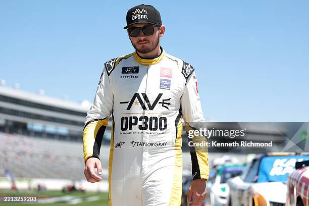 Taylor Gray, driver of the Operation 300 Toyota, walks the grid prior to the NASCAR Xfinity Series Andy's Frozen Custard 300 at Texas Motor Speedway...