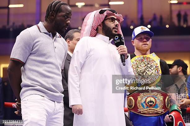 Terence Crawford, Turki Al-Sheikh and Saul "Canelo" Alvarez after the super middleweight fight on the Fatal Fury City of Wolves card at ANB Arena on...