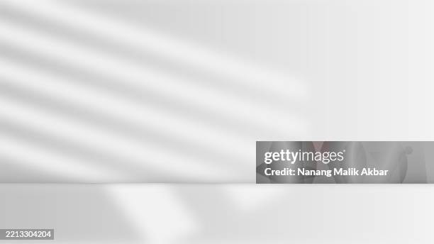 empty studio room with shadow and table for showing products - leaf shadow table stock illustrations