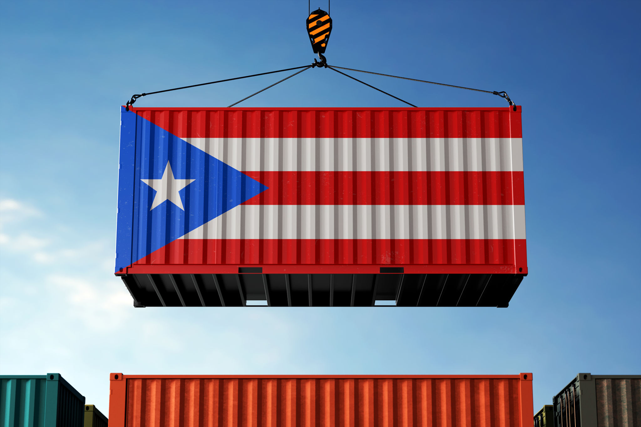 Puerto Rico trade cargo container hanging against clouds background Puerto Rico trade cargo container hanging against clouds background