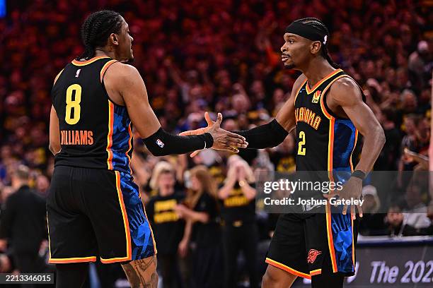 Jalen Williams and Shai Gilgeous-Alexander of the Oklahoma City Thunder celebrate during the first half of game two of the Western Conference...