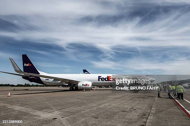 This photograph shows a FedEx Corporation's cargo plane on the tarmac of Liege airport in Grace-Hollogne on May 7, 2025. / Belgium OUT