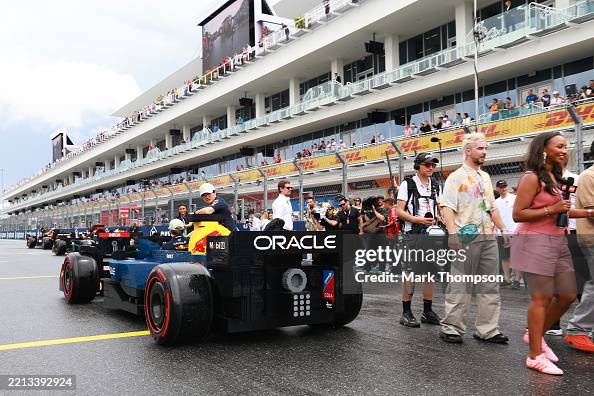 Oracle Red Bull Racing Japan Yuki Tsunoda of Japan and Oracle Red Bull Racing and Max Verstappen ...