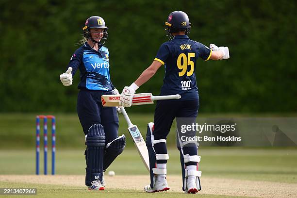 Bethan Ellis of Warwickshire celebrates hitting the winning runs with team mate Issy Wong during the Metro Bank One Day Cup match between Surrey...
