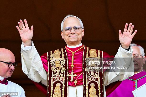 Newly elected Pope Leo XIV, Robert Prevost arrives on the main central loggia balcony of the St Peter's Basilica for the first time, after the...
