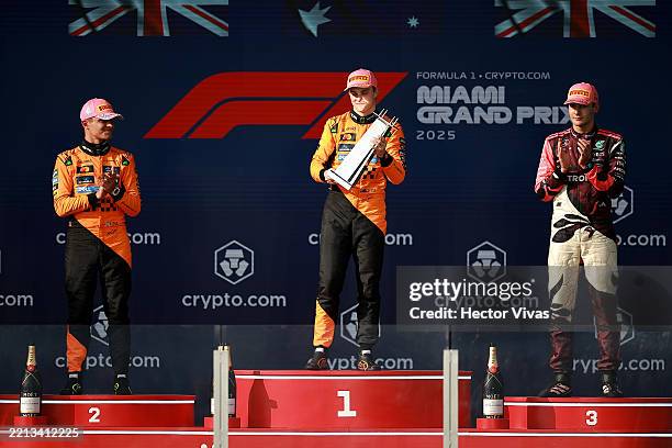 Race winner Oscar Piastri of Australia and McLaren Second placed Lando Norris of Great Britain and McLaren and Third placed George Russell of Great...